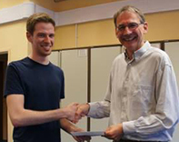 Benno Simmons (left) receiving his award from Dr Nick Mundy