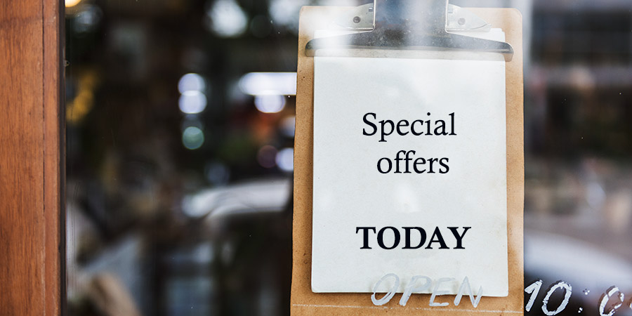 Special offers notice on clipboard