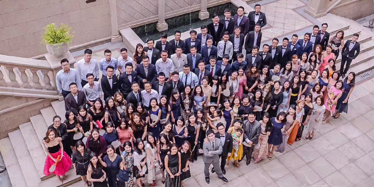 A photograph of a crowd of alumni taken at a group event