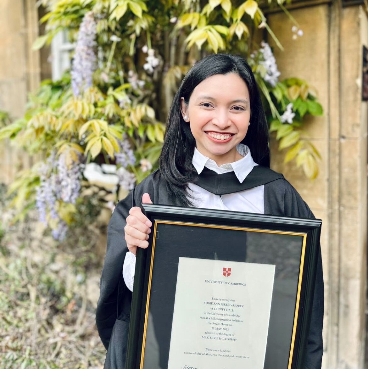 Rogie Vasquez holding her degree certificate
