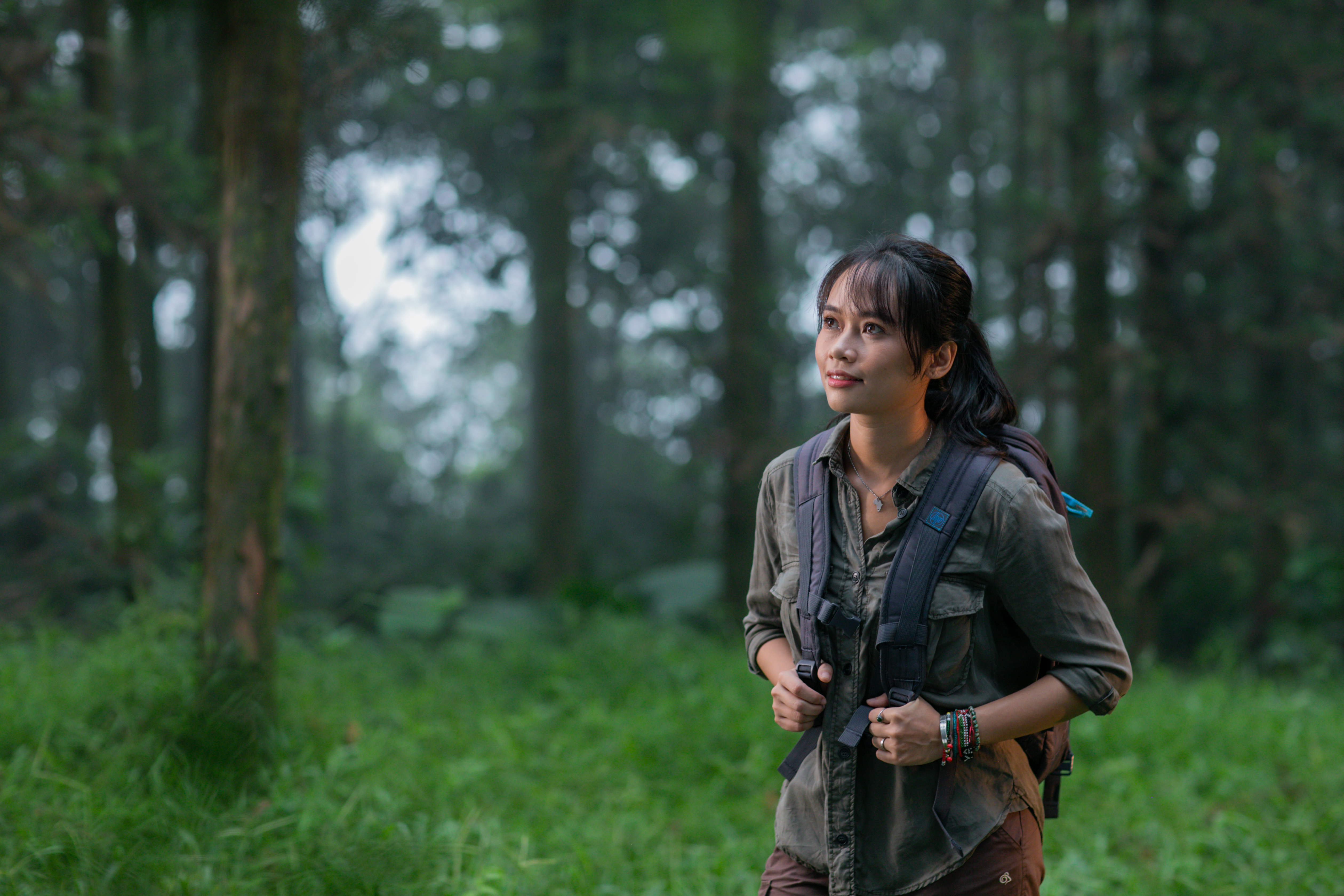 Trang Nguyen in a forest