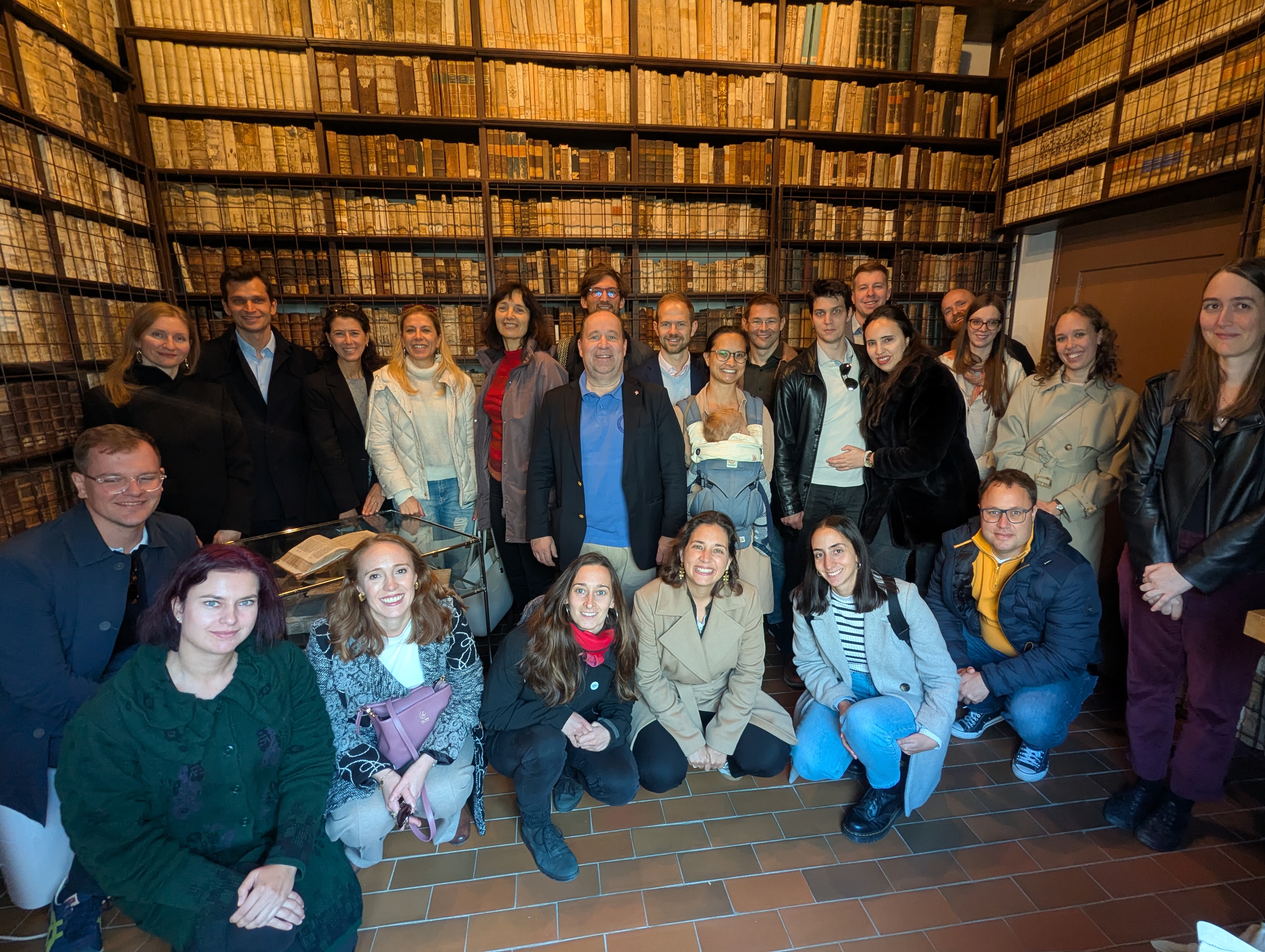 Group of alumni at the library