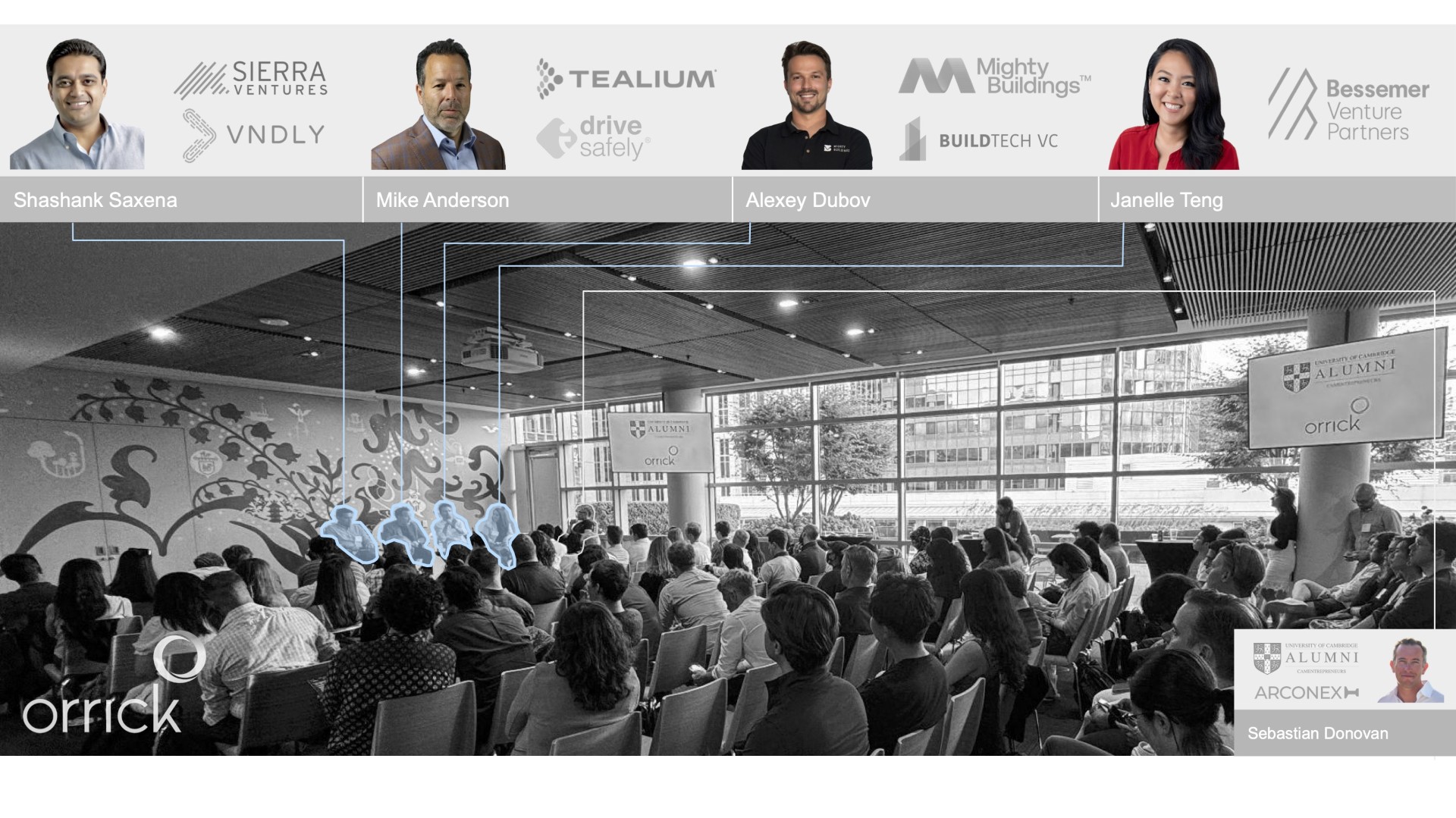 Photograph of the event highlighting the speakers in the crowd