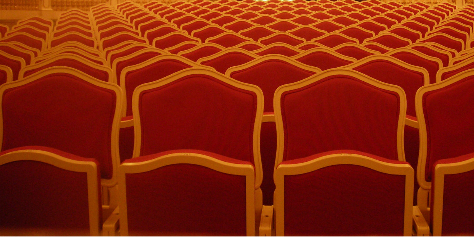 Red theatre seats viewed from the stage