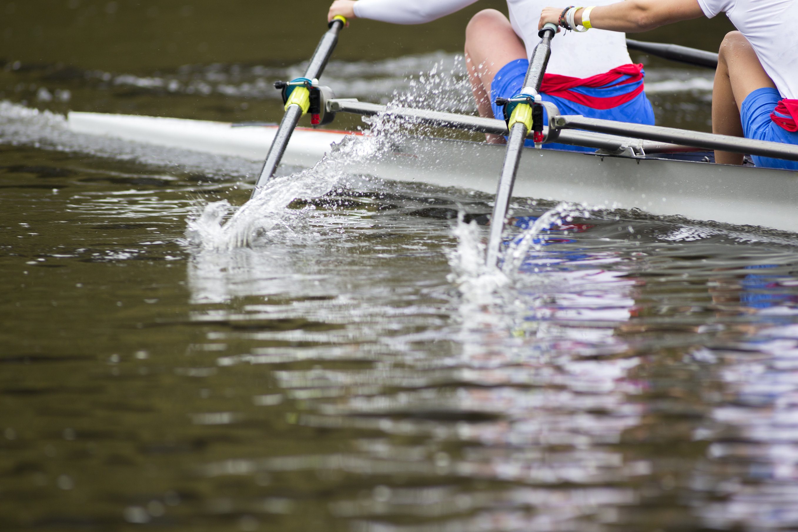 Oars break the water on a river