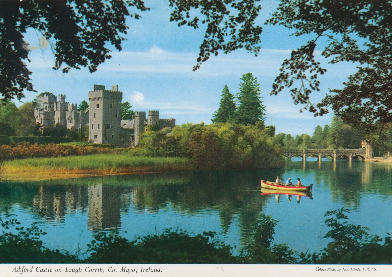 Old postcard of rural scene featuring a castle and rowing boat