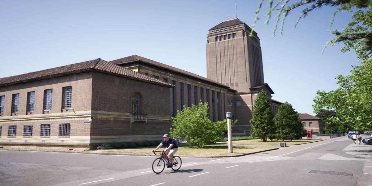 Cyclist passing the University Library.