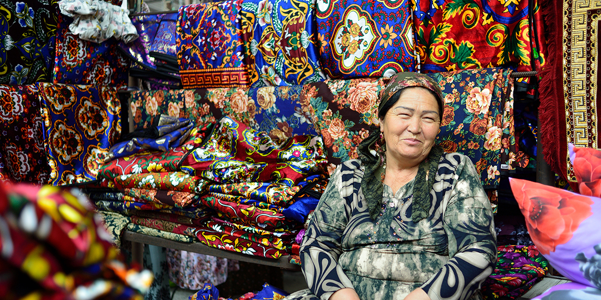 Sitting woman, surrounded by colour material