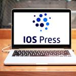 Laptop on desk with IOS logo showing