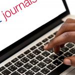 SAGE Journals logo on laptop