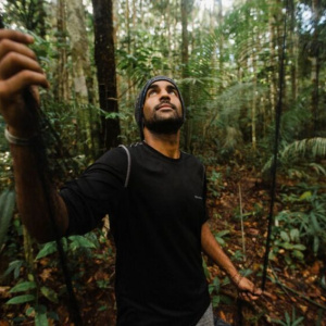 Ricardo standing in the Amazon rain forest