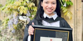 Rogie Vasquez holding her degree certificate