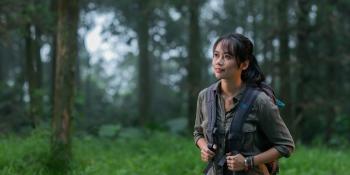 Trang Nguyen in a forest