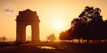 Photograph of the India Gate, New Delhi, with Global Cambridge logo