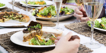 Outdoor lunch with wine and cake