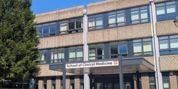 The front of the School of Clinical Medicine building on a sunny day.