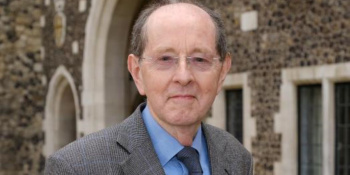 Photo of Sir Paul Britton outside a church