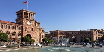 Republic Square, an oval roundabout and a trapezoid-shaped section with orange buildings basked under blue skies
