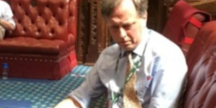 photograph of andrew makower sat on bench in parliament