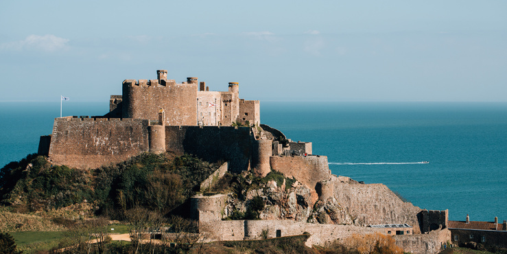 View of Gorey Castle with blue sea in the background