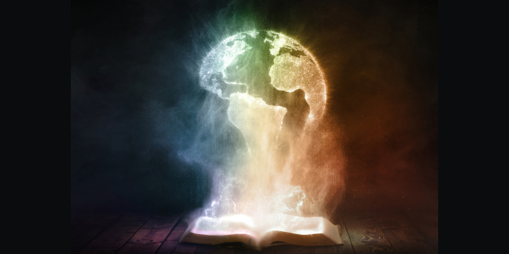 An open book glows brightly and reveals a globe of the world.