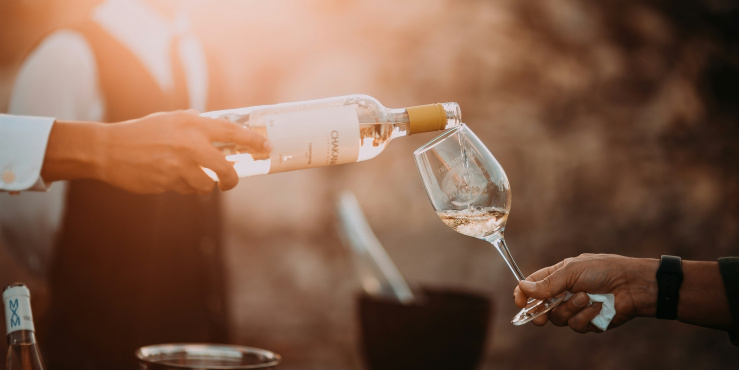 Glass or wine being poured
