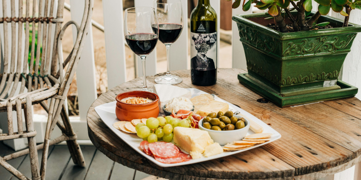 Cheese and wine glasses on table