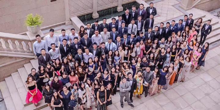 A photograph of a crowd of alumni taken at a group event
