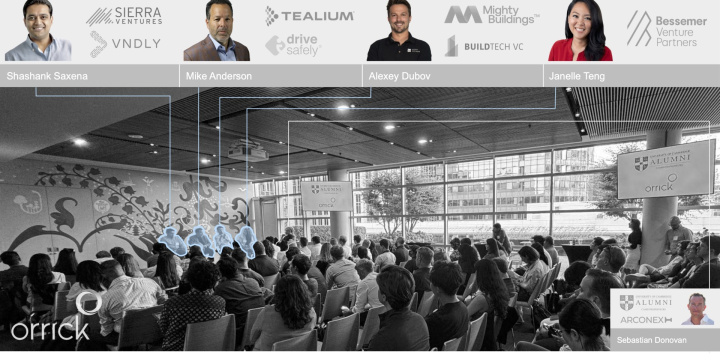 Photograph of the event highlighting the speakers in the crowd