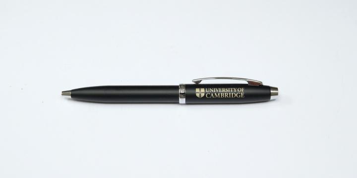 Black pen with University branding in gold