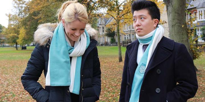 Alumni modelling the scarf with fleece