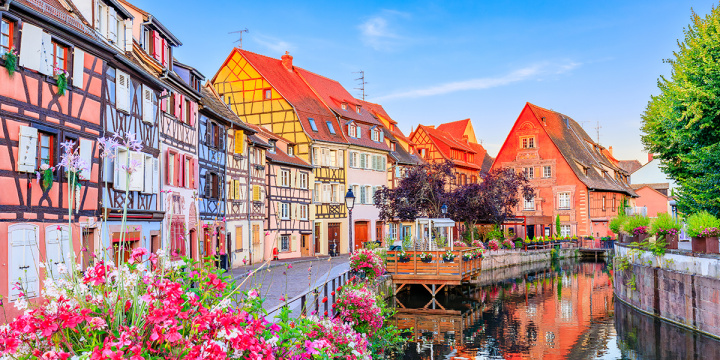 Colourful houses of Colmar lining the river side
