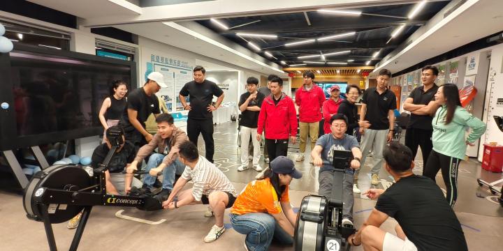 photoghraph featuring a number of people sat on ergs at a sports centre