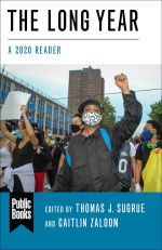 Front cover showing a man in a face mask in a protest doing the Black Lives Matter fist signal