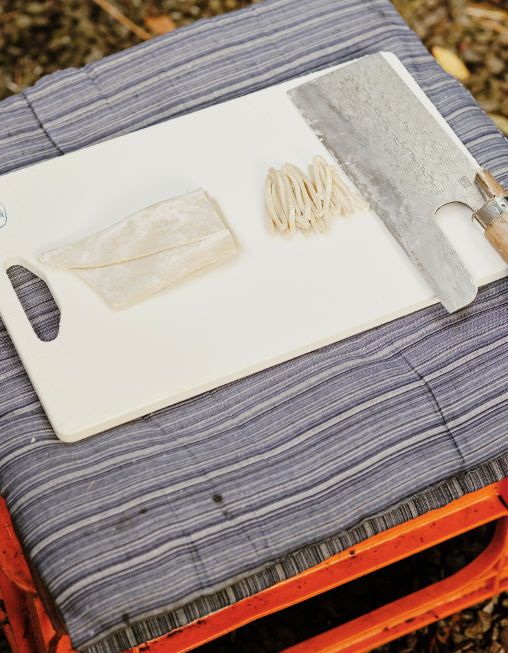Chopping board with food being prepared
