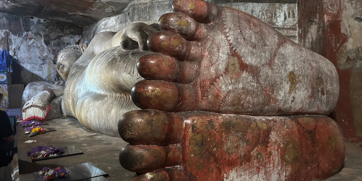 Budda laying down showing his feet in temple