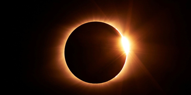 Eclipse with a orange rim around the moon