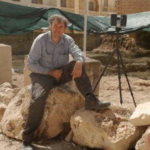 Professor Stoddart sat on a rock
