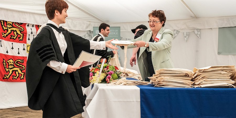 Volunteer helping at a degree ceremony