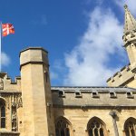 University flag flying above Old Schools