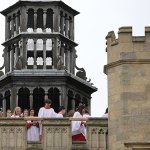 Choir singing from Trinity College's tower
