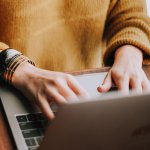 Lady sat at desk with laptop