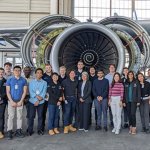 people and a plane engine