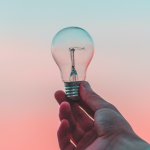 image of person holding a lightbulb