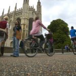 Students cycling in front of King's