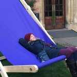 person in giant deck chair