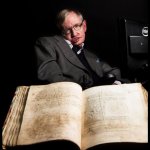 image of Stephen Hawking with a book from archive