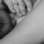 Women breastfeeding a baby
