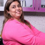 Woman with obesity washing food
