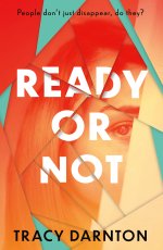 Front cover showing half of a female face with one eye showing, on a broken-glass style abstract pattern in orange and green
